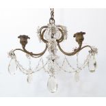 An early 20th century gilt-metal and cut-glass six-light chandelier with original hanging chain (