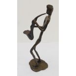 An Art bronze statue of a saxophonist drawing breath (28 cm high)