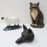 Three painted cast-metal doorstops fashioned as a fox, a sheep and a cat