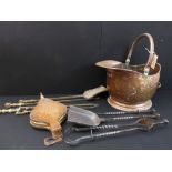 A group of eight to include: a 19th century copper helmet-shaped coal scuttle; two sets of fireirons