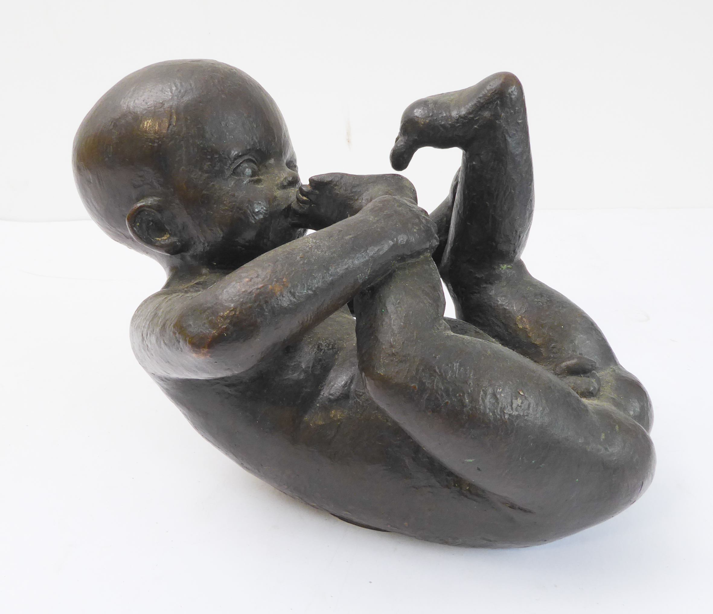 HERMANN LICKFELD (1898-1941) : an interesting bronze sculpture of a nude male infant, signed on