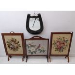 Three freestanding fire screens: each hand-stitched in gros point, two depicting flowers and the