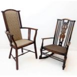An Edwardian Arts and Crafts style mahogany and upholstered armchair: the vertical, floral