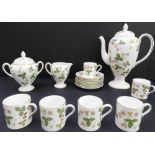 A Wedgwood 'Wild Strawberry' coffee service: 6 coffee cans and 7 saucers, coffee pot (25 cm high),