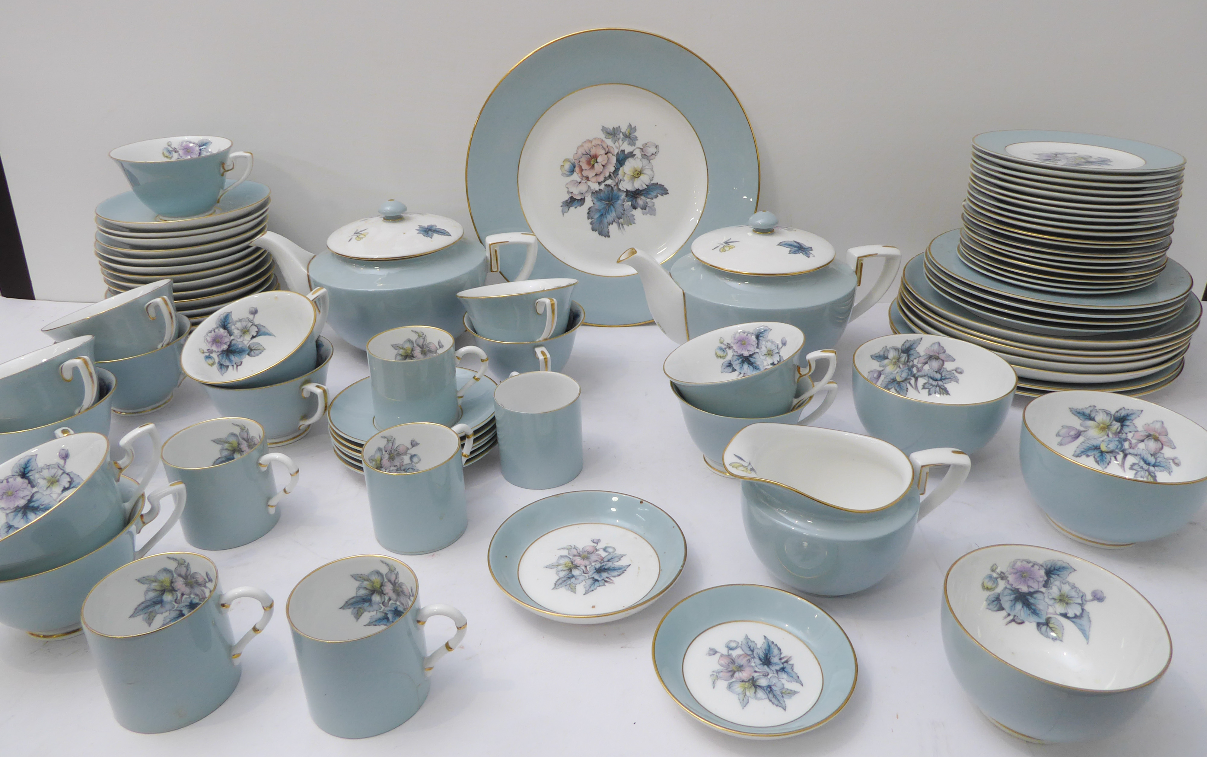 A circa 1970s Royal Worcester 'Woodland' tea and dinner service comprising: two tea pots; 13 teacups