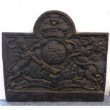 A large and heavy 17th century-style cast-iron fireback decorated with the royal coat of arms (71 cm