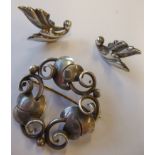 A Georg Jensen design silver-coloured brooch, together with a small pair of Jensen silver leaf-