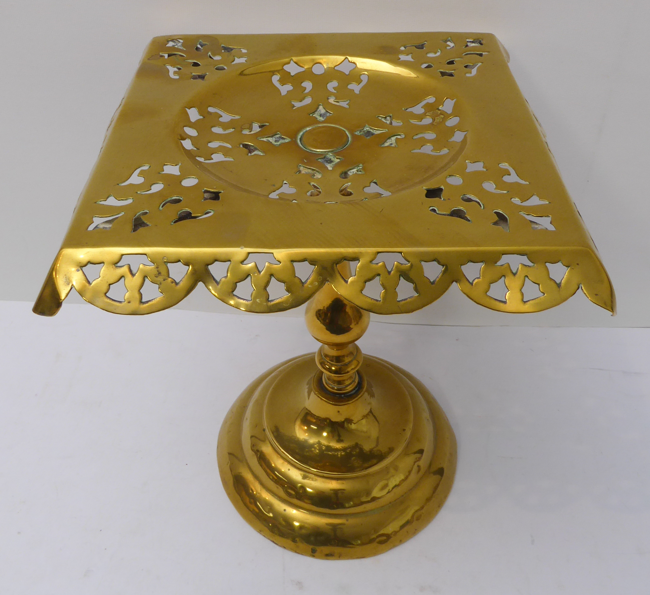 An assortment of metalware to include: an early 20th century brass trivet; a 19th century spirit- - Image 6 of 11