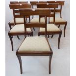 A set of six Regency-style mahogany dining chairs: each with concave top rail, sabre front legs