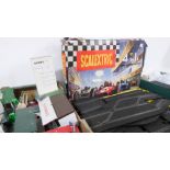 A large quantity of Scalextric track, accessories, buildings, fencing, grandstands, other associated