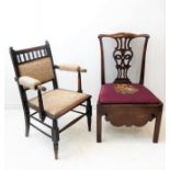 An 18th century mahogany commode chair with floral needlework drop-in seat and deep shaped friezes