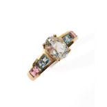 A tourmaline and topaz ring stamped 10K, ring size N/O