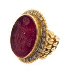 An oval intaglio carved ring with diamond border, the shank stamped '18K', ring size N  Motto “PER