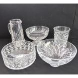 Five pieces of cut glassware: three bowls (one with 'nibbles' to rim); a tall and elegant hand-cut