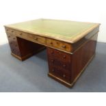 A large mahogany partners desk: green gilt-tooled leather inset and thumbnail moulded top; an