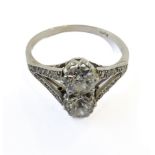A diamond two-stone ring; each old brilliant-cut diamond estimated to spread 0.50ct to the diamond-