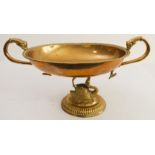 An early 20th century Dutch brass fruit bowl;  beaded oval rim and cast dolphin handles; the cast
