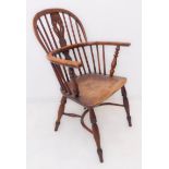 An early/mid 19th century yew wood Windsor chair: pierced splat, shaped elm seat and turned