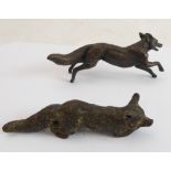 Two early 20th century bronzes modelled as a running fox signed 'P.H' and a crouching vixen