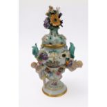 A 19th century hand-decorated German porcelain potpourri: the reticulated dome-topped gilt