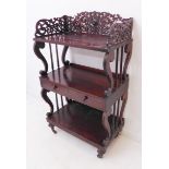 The matching three-tier rosewood whatnot: three-quarter pierced fretwork gallery above shelves