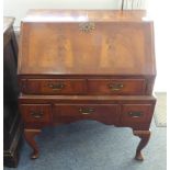 An early 20th century fall-front bureau-on-stand in George I style and of compact proportions: