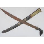A 19th century Indonesian / Malayan short sword: very finely carved and patinated pierced wooden