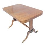 A mahogany centre table: figured top with round corners above standard style ends united by a high