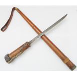 An unusual late 19th to early 20th century dual purpose knife and scabbard: 21.8 cm slender blade