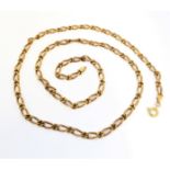 A flattened fancy link chain necklace, stamped '375' (61cm long, 20.5g)