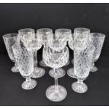 A set of eight hand-cut hock glasses with star-cut bases, together with a set of four hand-cut