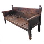 A fantastic solid oak settle (17th/18th century?): the planked back flanked by two slightly two