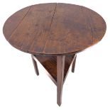 A late 18th century circular oak cricket table: three legs united by a central triangular platform