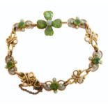 An Edwardian peridot , seed pearl and 15-carat yellow gold link bracelet composed of openwork