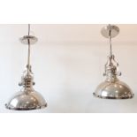 A pair of steel ceiling downlighters in the Art Deco taste (52.5 cm high and 31.25 cm in diameter)