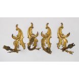 A set of four late 19th century Louis XV style gilt-metal wall appliques (converted from gas to