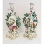 A pair of early 19th century Chelsea 18th-century-style porcelain boscage pastoral figurative