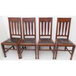 A good set of four late 19th/early 20th century darkly patinated oak dining chairs in Arts and