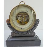 A 19th century French circular brass holosteric barometer: Réaumur and Fahrenheit thermometers;