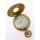 An early 20th century gold-plate-cased half-hunter pocket watch: white enamel dial signed 'Elgin'