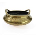 A Chinese polished brass/bronze two-handled tripod censer in 17th century style: six character