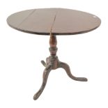 An 18th century George III period circular tilt top oak tripod table (with restorations) and