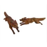 Two early 20th century Austrian cold-painted bronzes modelled as running foxes. Unsigned, but