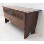 A late 17th/early 18th century oak chest of small proportions: the overhanging single plank top