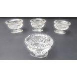 A set of four hand-cut urn-shaped clear-glass salts (probably late 19th/early 20th century): each