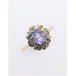 A tanzanite and diamond cluster 9-carat gold ring, ring size K/L