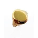 A 9-carat yellow gold signet ring, the blank oval plaque to the hallmarked tapering shank, ring size