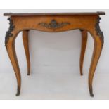 A 19th century amboyna and gilt metal-mounted (faded) bijouterie table of exceptional quality: the