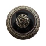 A 19th century silver brooch centrally set with marquisates into a polished tiger's eye hardstone (
