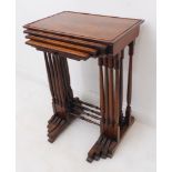 A set of four early 19th century late Regency period rosewood quartetto tables: the second table top
